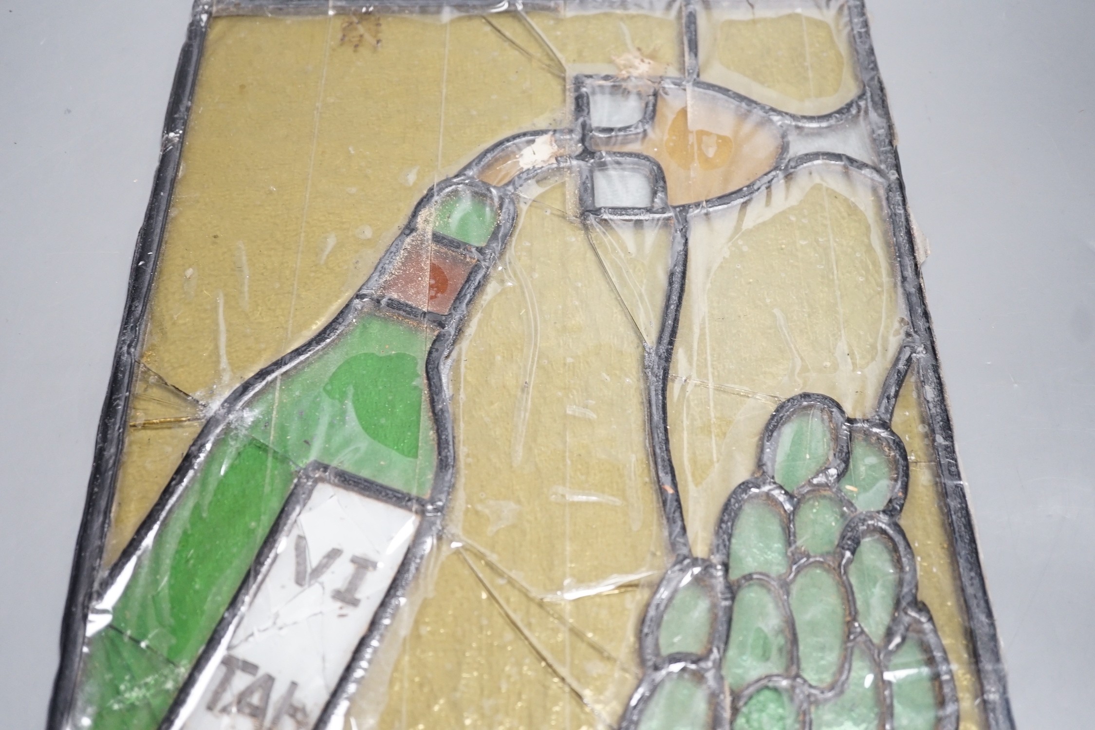 A wine related stained glass panel, 28cms wide x 38cms high